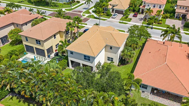 an aerial view of a house with a yard and potted plants