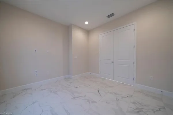 a bathroom with a shower and a sink