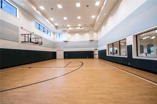 a view of a patio with a table chairs couches and wooden fence