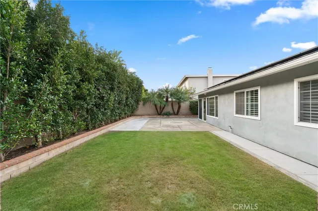 a view of a backyard with potted plants