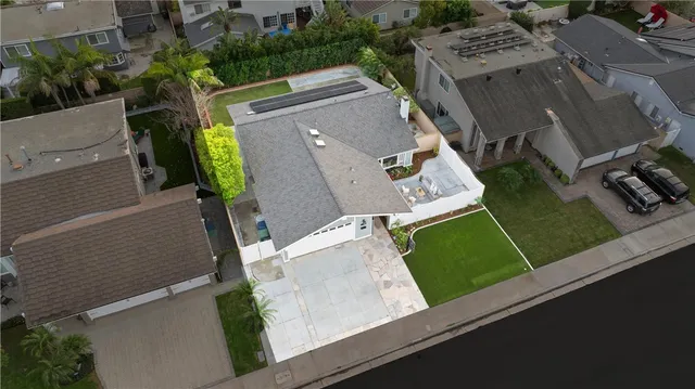an aerial view of a house with a garden and trees