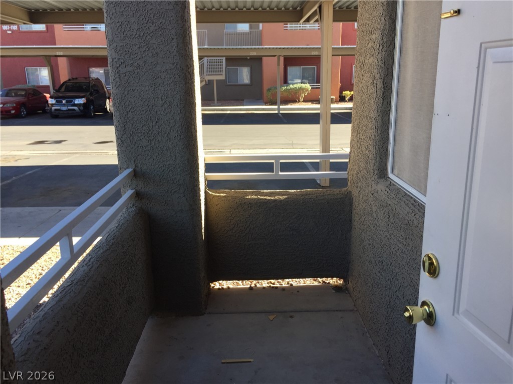 4730 East Craig Road, Unit 1091 Las Vegas, NV 89115 - Photo 14 of 14 A welcoming entry balcony overlooks convenient covered parking in a community setting.