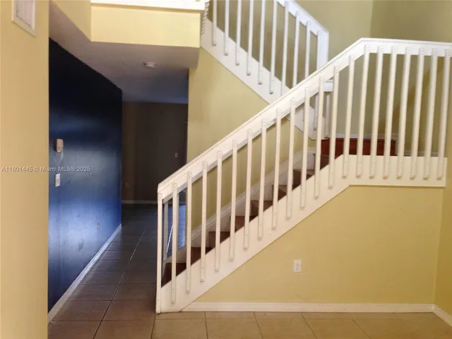 a view of a hallway with staircase