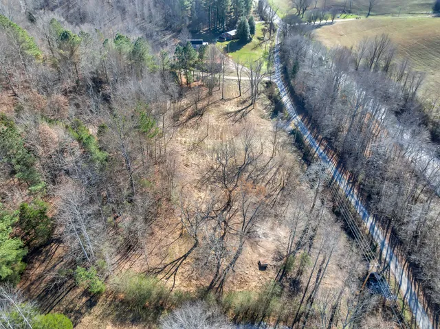 a backyard of a house and trees
