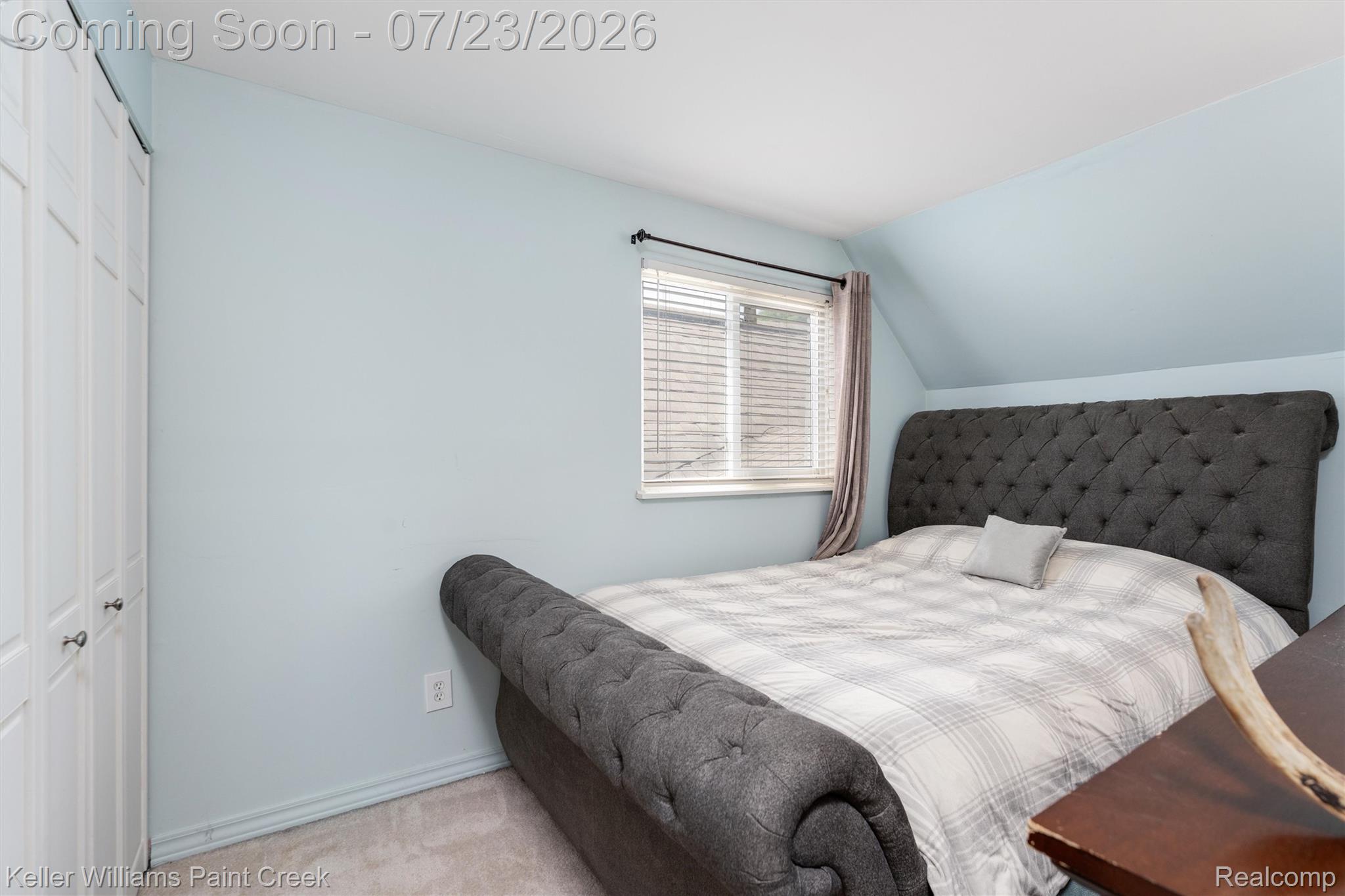 2611 Quail Run Street Rochester, MI 48306 - Photo 22 of 48 Room featuring light blue walls, white bi-fold closet doors, and light-colored carpeting