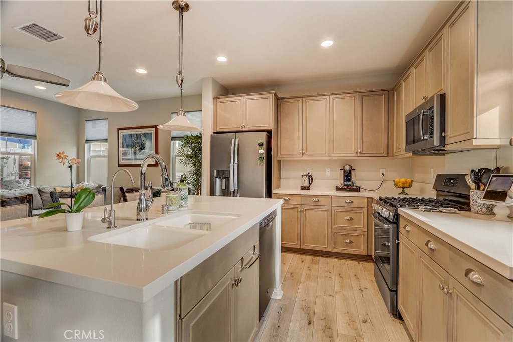 193 Stonegate Road Camarillo, CA 93010 - Photo 14 of 39 a kitchen with a sink stainless steel appliances and cabinets