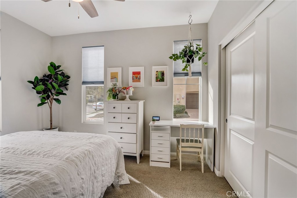 193 Stonegate Road Camarillo, CA 93010 - Photo 15 of 39 a bedroom with a large bed and a potted plant