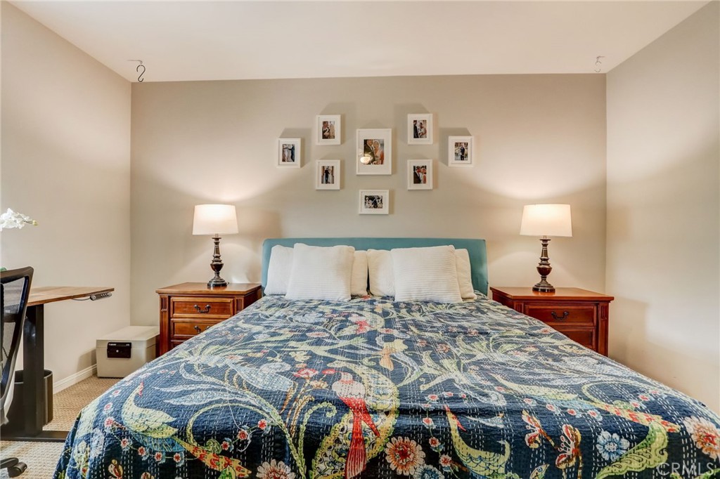 193 Stonegate Road Camarillo, CA 93010 - Photo 23 of 39 a bedroom with a bed and a lamp on dresser