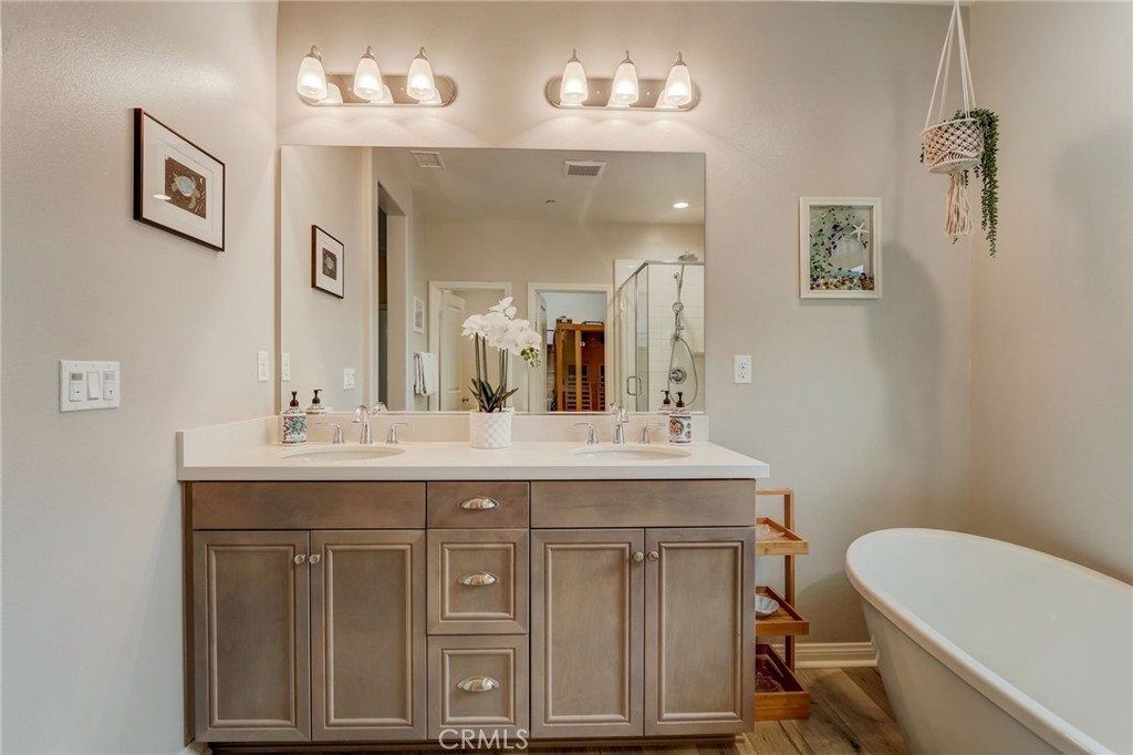 193 Stonegate Road Camarillo, CA 93010 - Photo 28 of 39 a bathroom with a granite countertop sink a toilet and a mirror