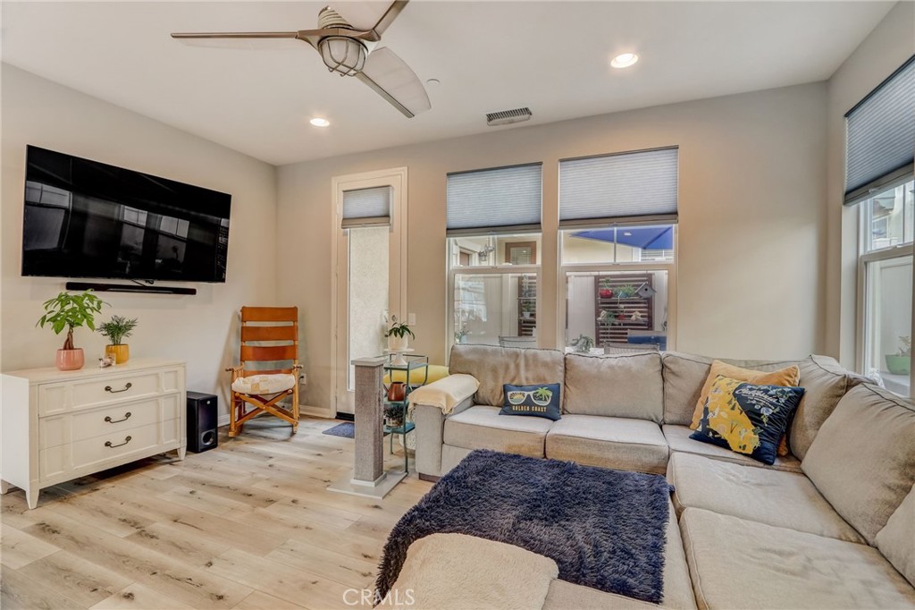 193 Stonegate Road Camarillo, CA 93010 - Photo 6 of 39 a living room with furniture and a flat screen tv