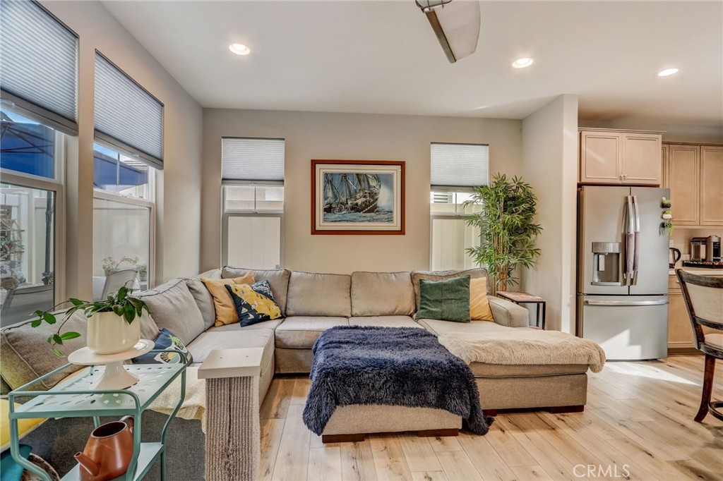 193 Stonegate Road Camarillo, CA 93010 - Photo 8 of 39 a living room with furniture and a refrigerator
