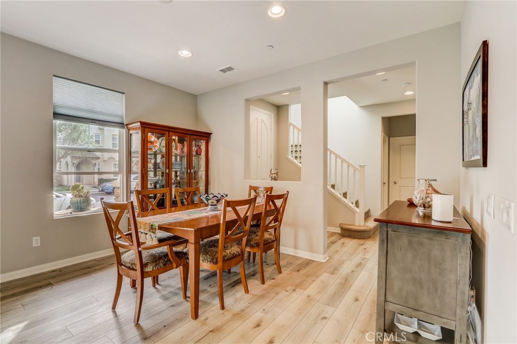 193 Stonegate Road Camarillo, CA 93010 - Photo 10 of 39 a view of a dining room with furniture and wooden floor
