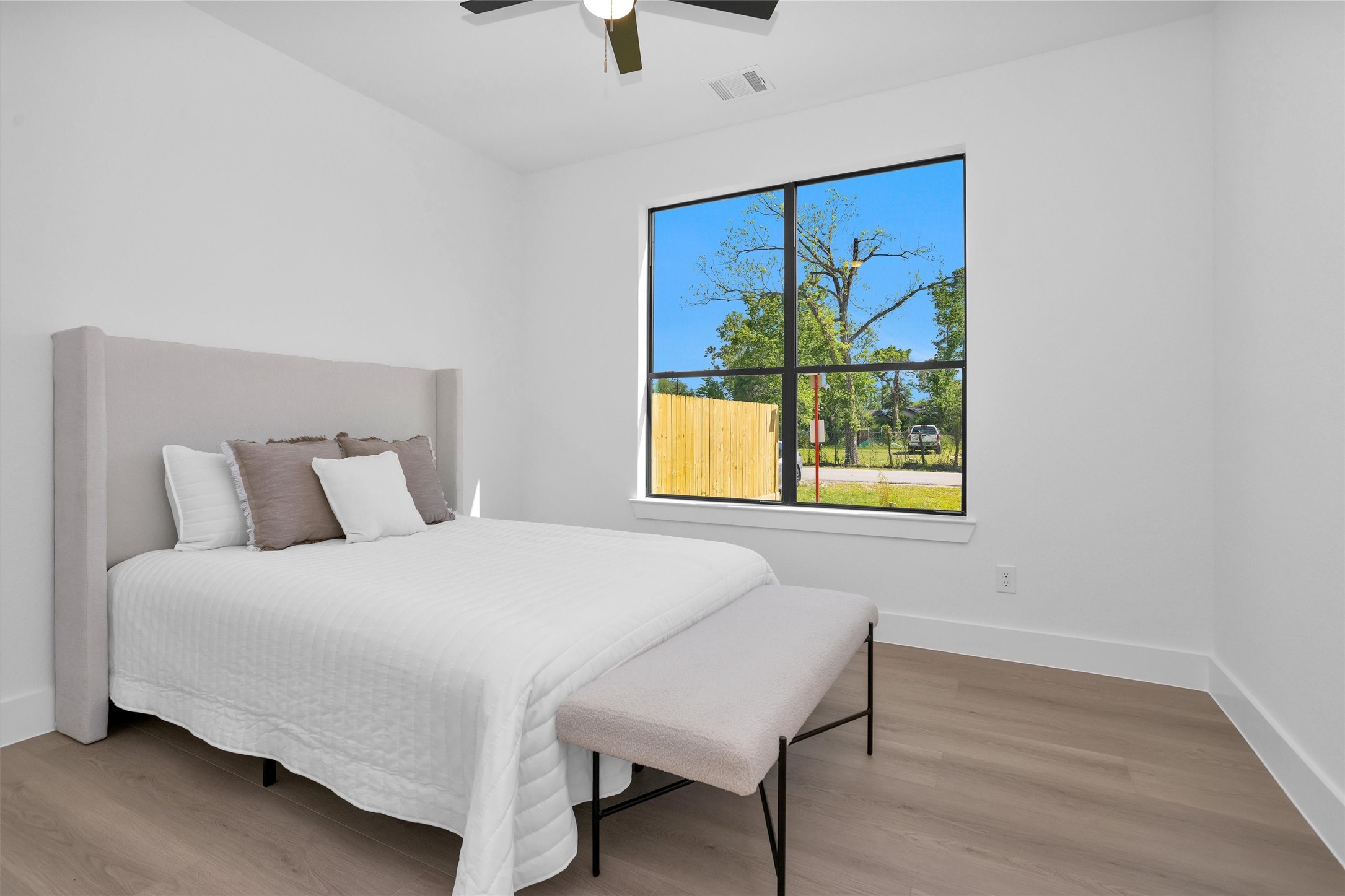 6334 Roughlock Street Houston, TX 77016 - Photo 12 of 24 a bedroom with a bed and a window