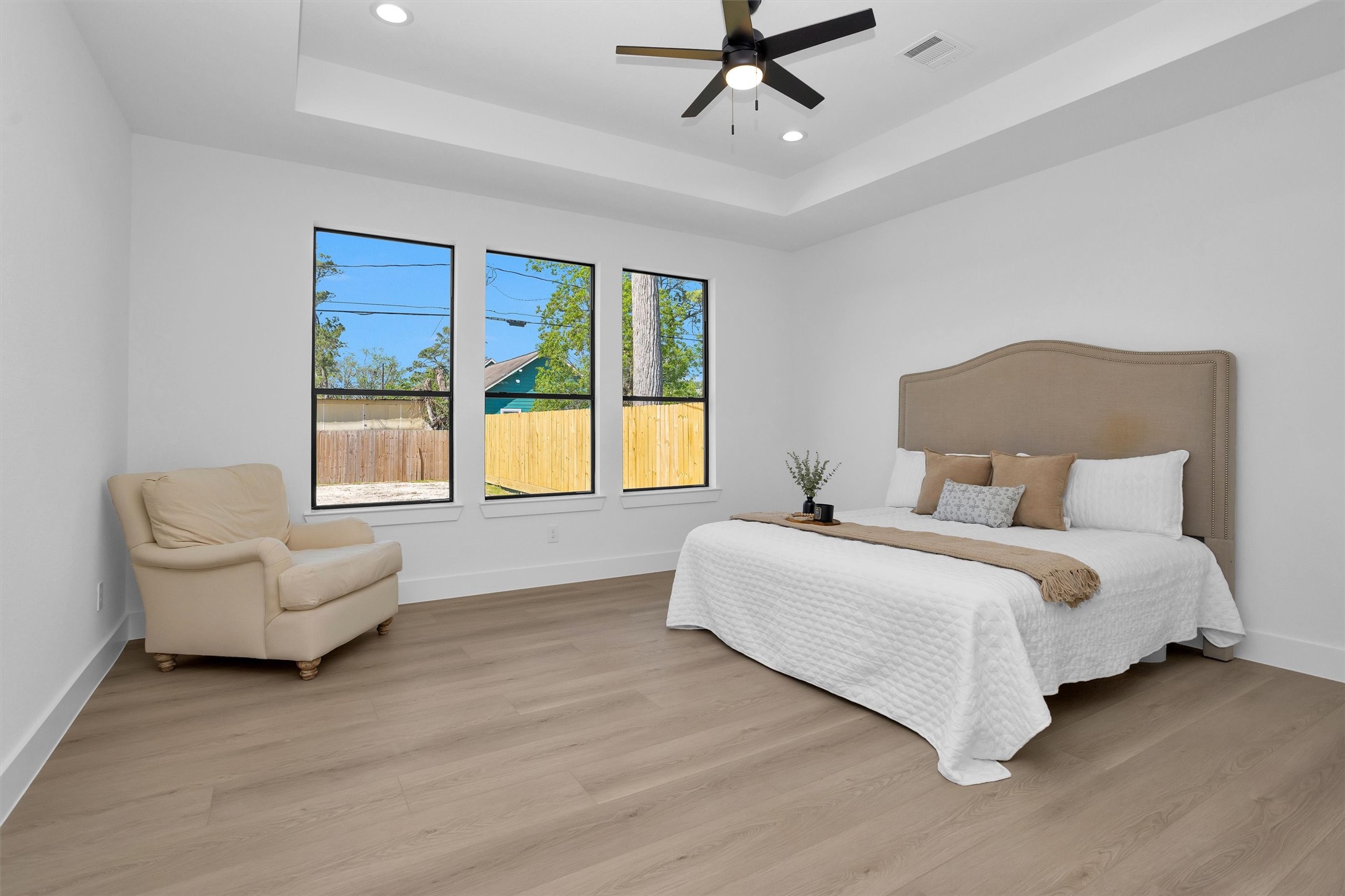 6334 Roughlock Street Houston, TX 77016 - Photo 17 of 24 a spacious bedroom with a bed and furniture