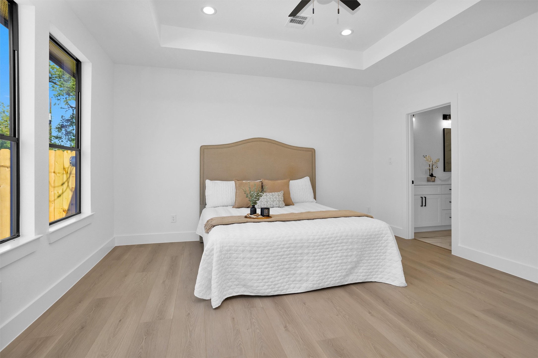 6334 Roughlock Street Houston, TX 77016 - Photo 18 of 24 a bedroom with a bed and window