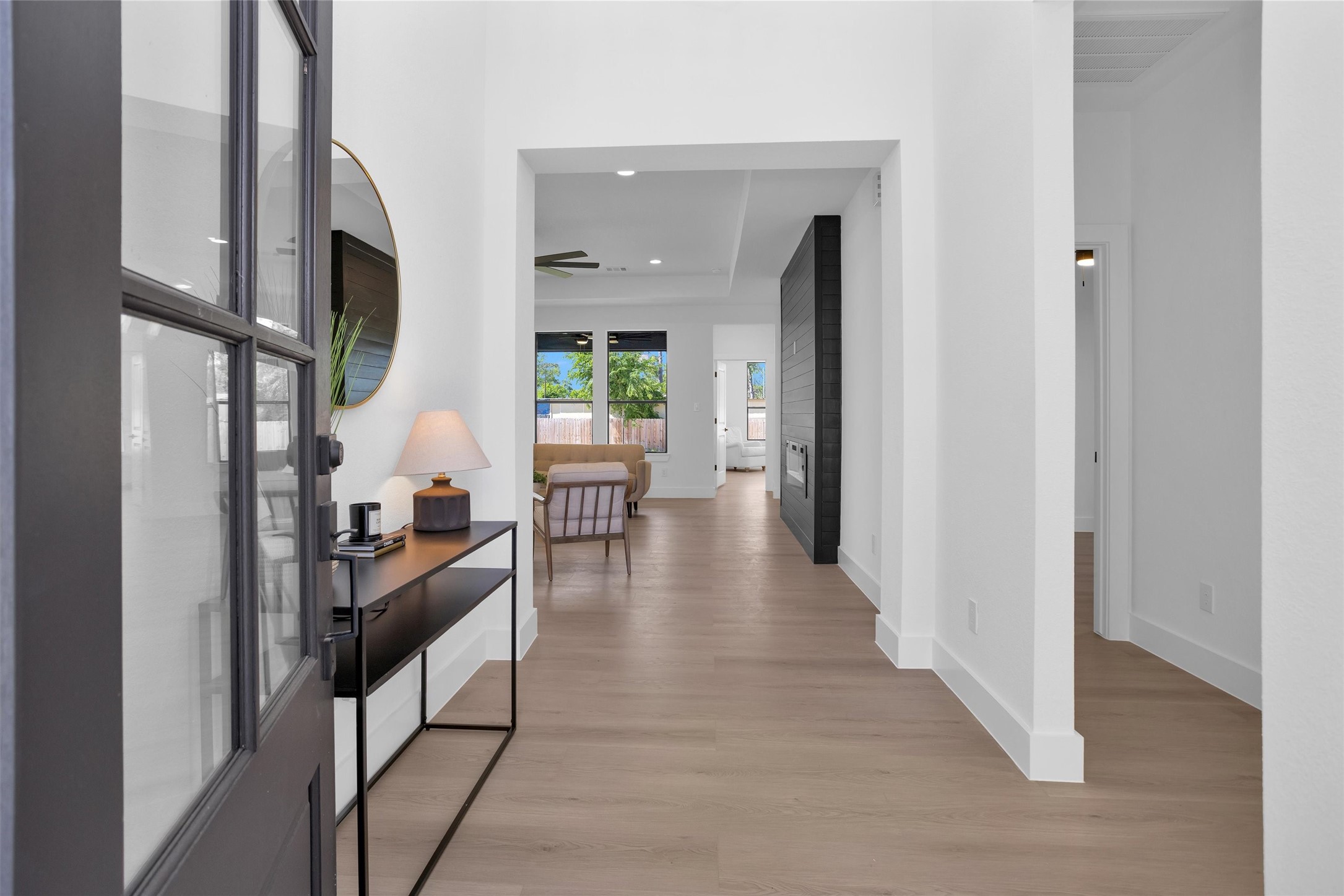 6334 Roughlock Street Houston, TX 77016 - Photo 4 of 24 a hall way with furniture and a potted plant