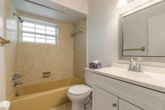a bathroom with a sink toilet and bathtub