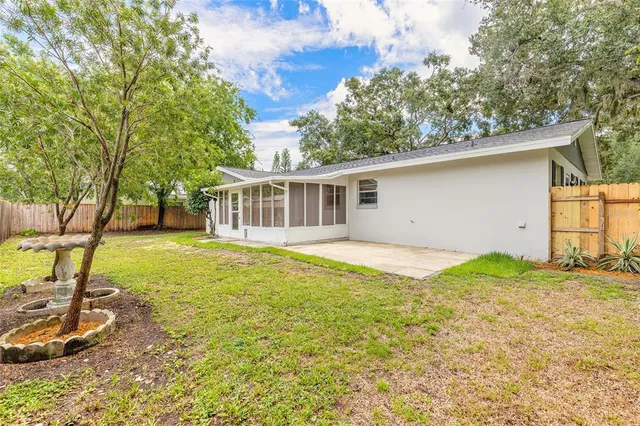 a house with swimming pool in front of it
