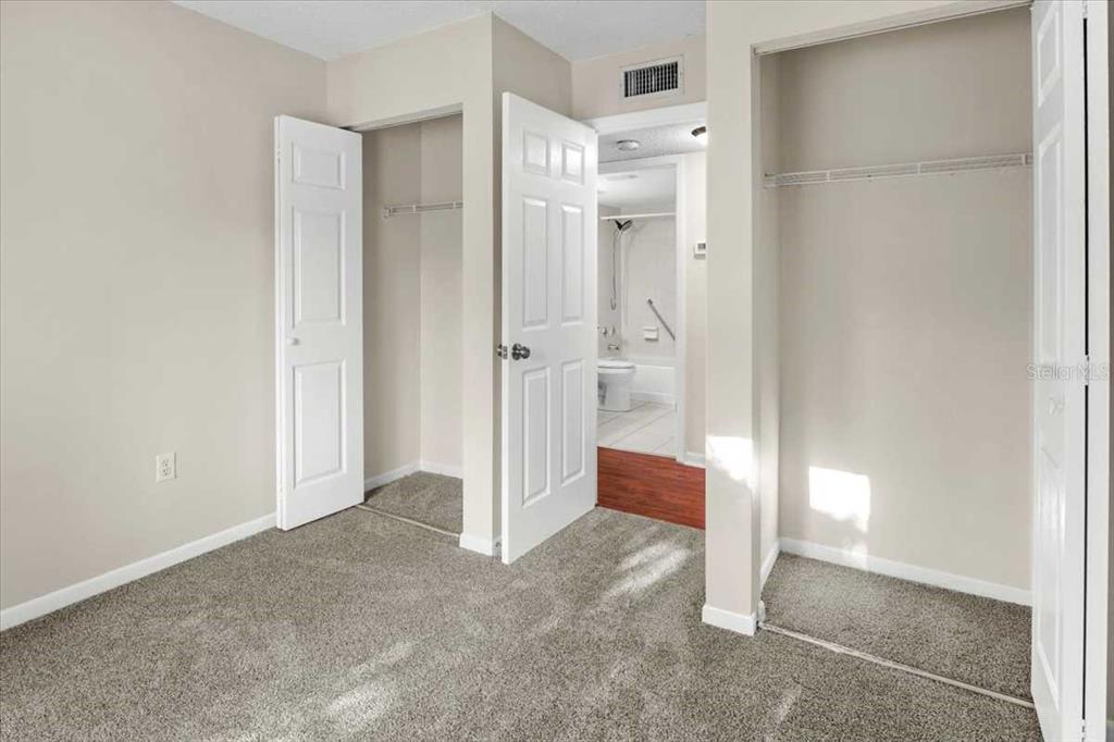 1127 Pine Ridge Circle West, Unit A2 Tarpon Springs, FL 34688 - Photo 11 of 18 a view of a bathroom with a shower