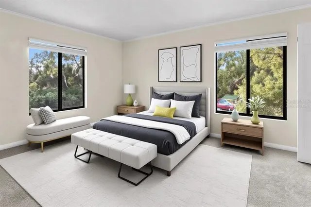 a spacious bedroom with a bed and glass window