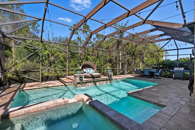 a view of a backyard with sitting area