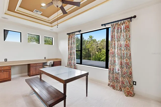 a workspace with furniture and window