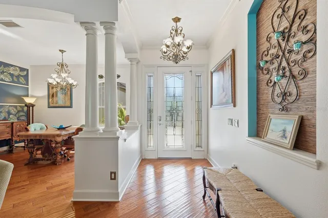 a view of a livingroom with furniture window and wooden floor