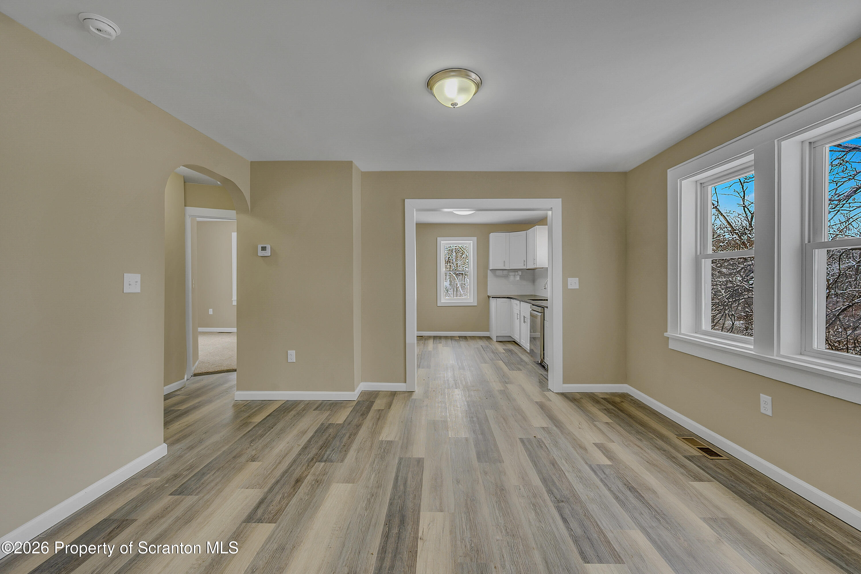 642 Bodle Road Wyoming, PA 18644 - Photo 13 of 33 a view of a room with wooden floor cabinet and windows