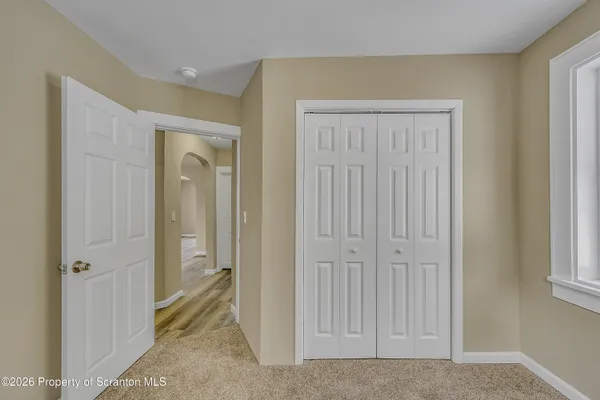 a view of a livingroom with a hallway