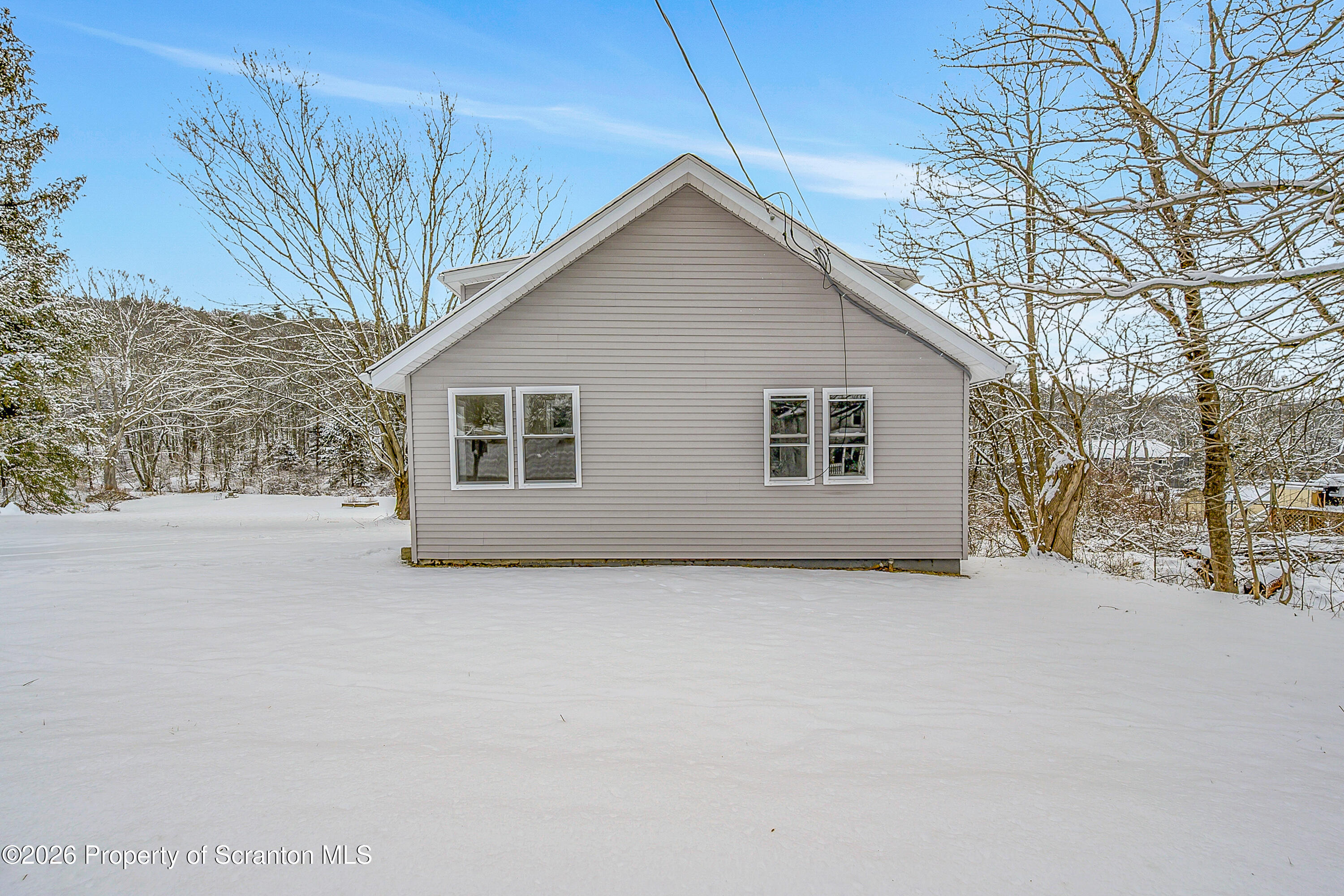 642 Bodle Road Wyoming, PA 18644 - Photo 2 of 33 a view of a house with a yard and garage