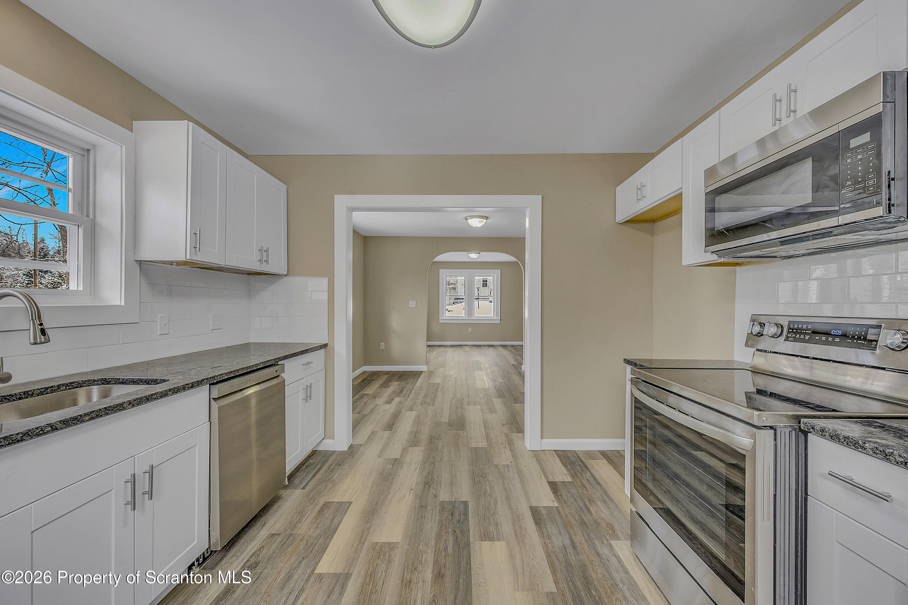 642 Bodle Road Wyoming, PA 18644 - Photo 31 of 33 a kitchen with a stove oven and sink
