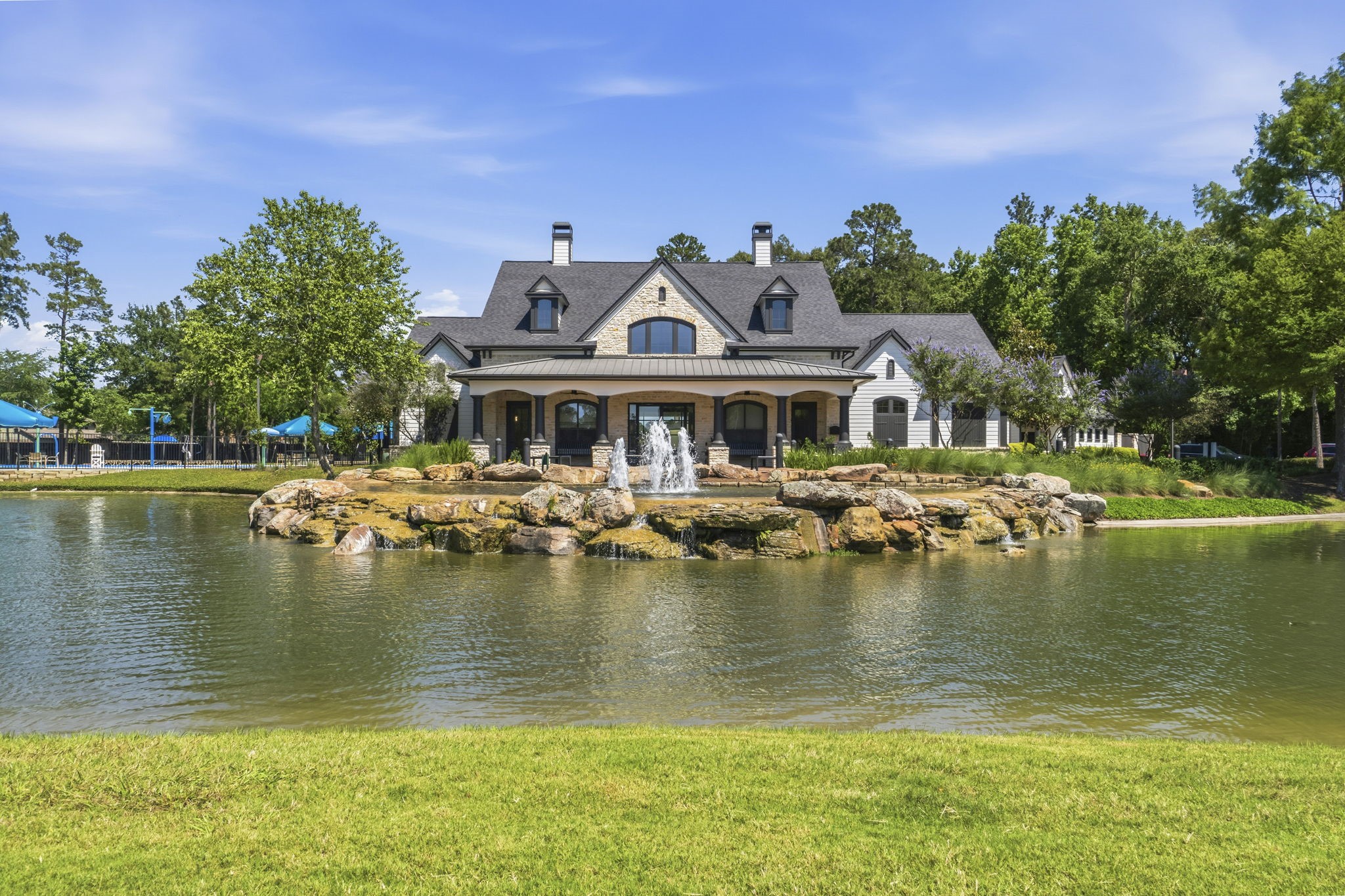 3900 Enchanted Timbers Lane Spring, TX 77386 - Photo 40 of 49 a view of a lake with a house swimming pool and outdoor space