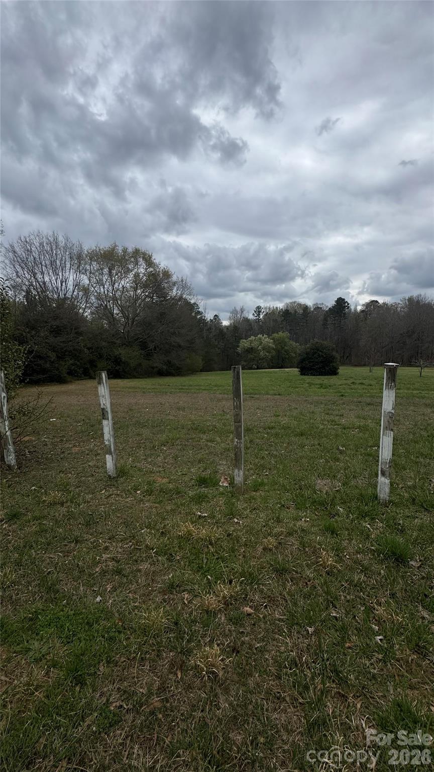 0 Lewis Road Gastonia, NC 28052 - Photo 2 of 15 a view of a lake with houses in back