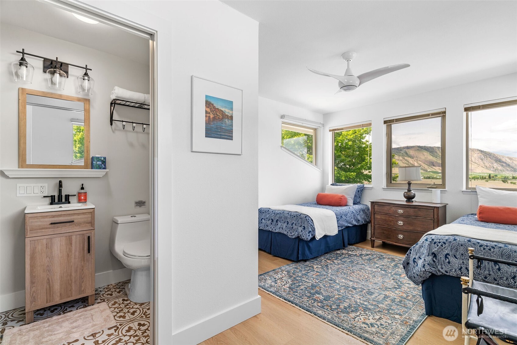 32 Midland Road Brewster, WA 98812 - Photo 23 of 40 a bedroom with a bed and wooden floor