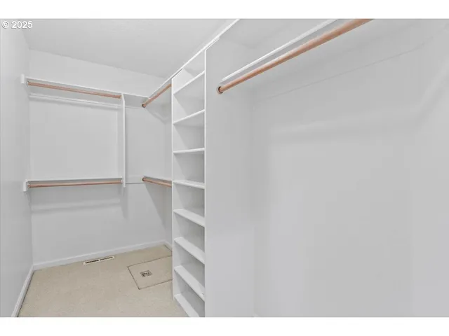 a view of an empty walk in closet