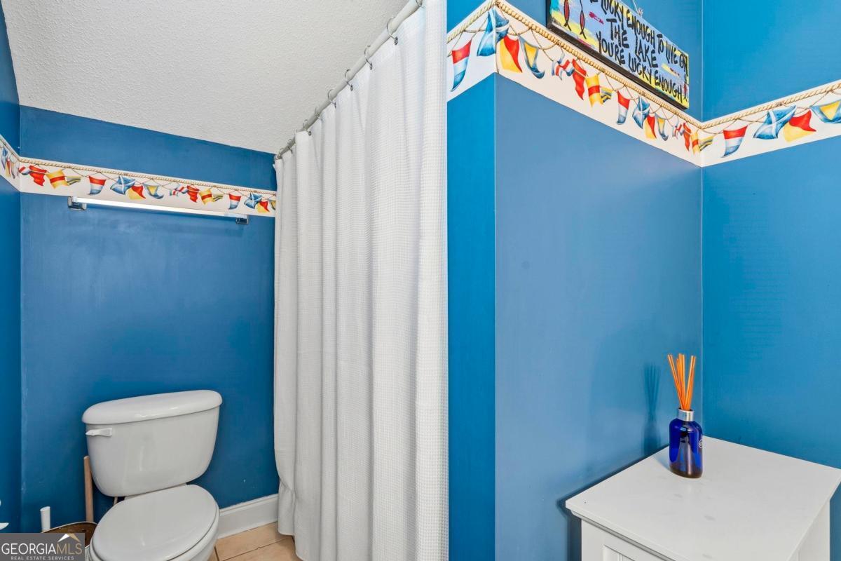 172 Mays Road Milledgeville, GA 31061 - Photo 37 of 54 a bathroom with a toilet and a sink