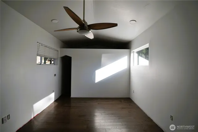 a dining room with furniture window and wooden floor