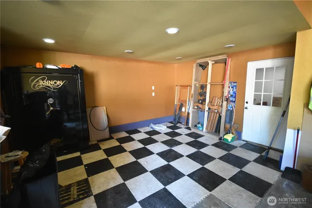 a view of a room with wooden floor