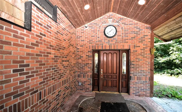 a kitchen with stainless steel appliances granite countertop a refrigerator a sink a stove and wooden floor