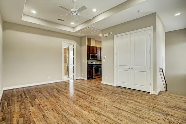 a bathroom with a granite countertop sink mirror toilet and bathtub