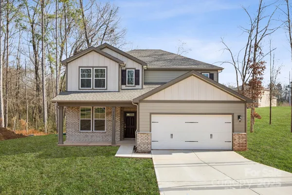 a view of a yard in front view of a house