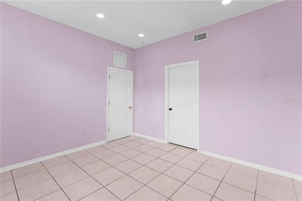 a view of hallway with wooden floor