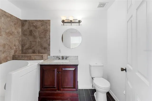 a view of hallway with wooden floor