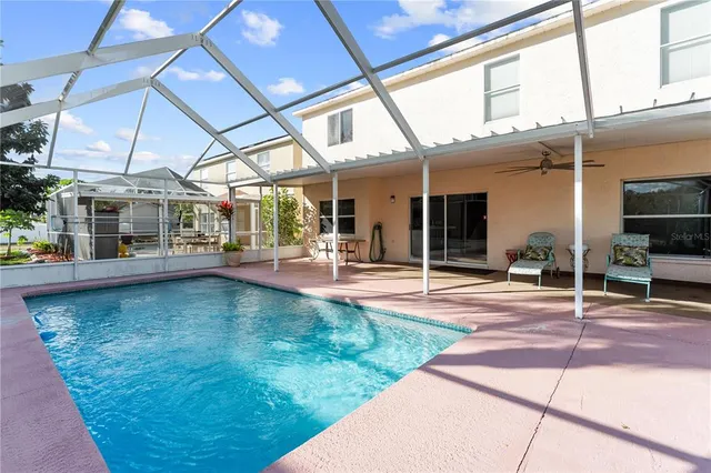a view of a swimming pool with a patio