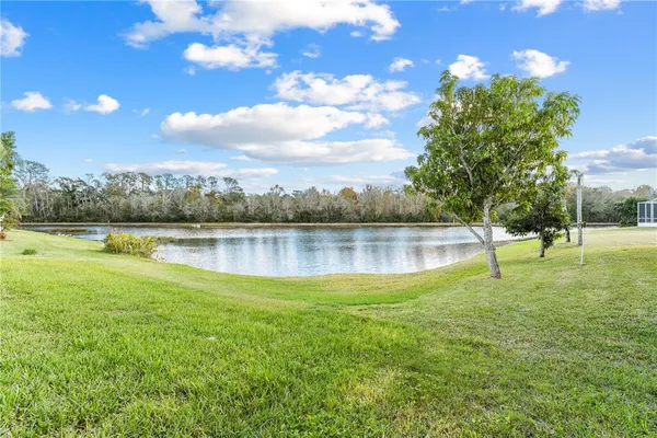 an aerial view of residential houses with outdoor space and swimming pool