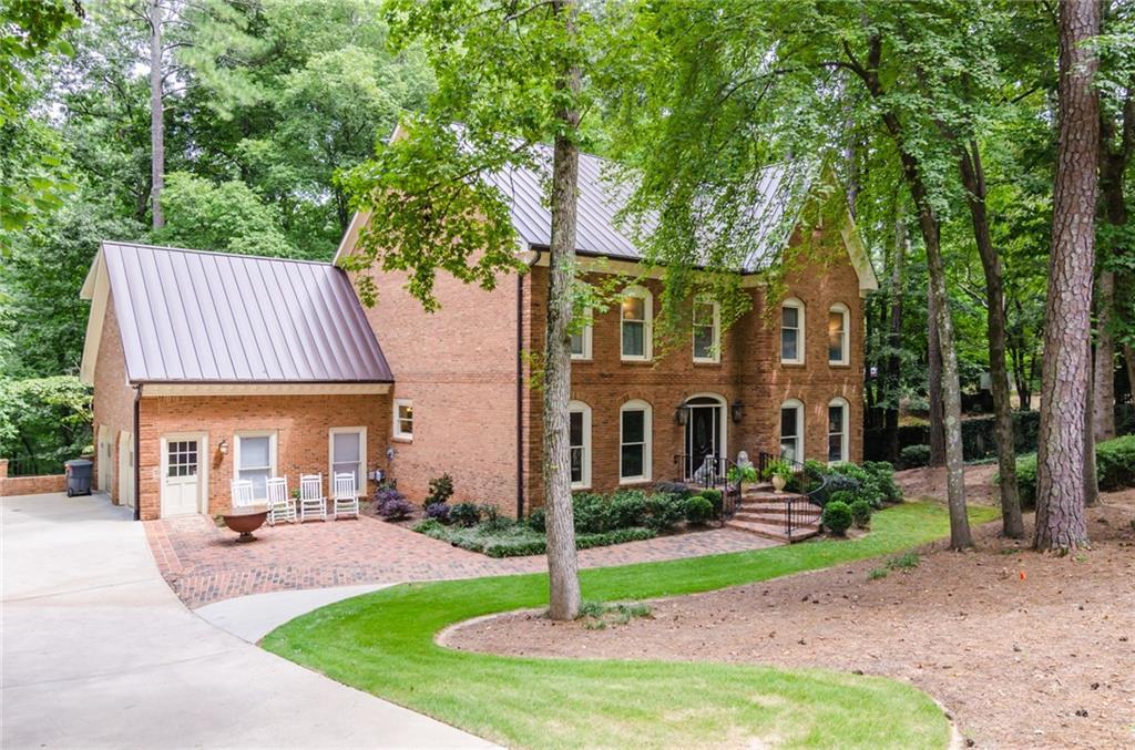 6895 Brandon Mill Road Northwest Sandy Springs, GA 30328 - Photo 1 of 1 Beautiful 3-Sided Brick Home conveniently located minutes from Sandy Springs City Center