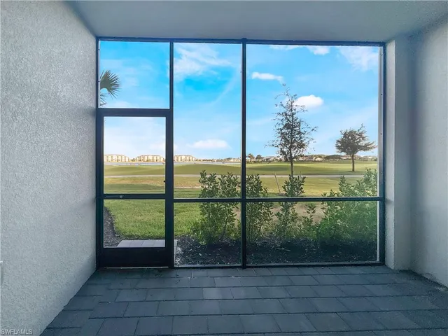a view of multiple houses with a street