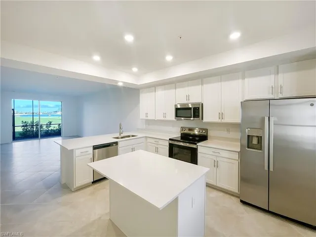 a view of an empty room and a window