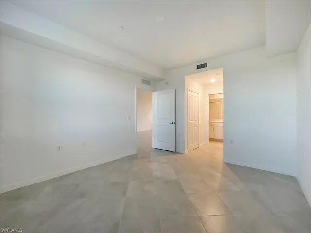 a bathroom with a shower sink and mirror