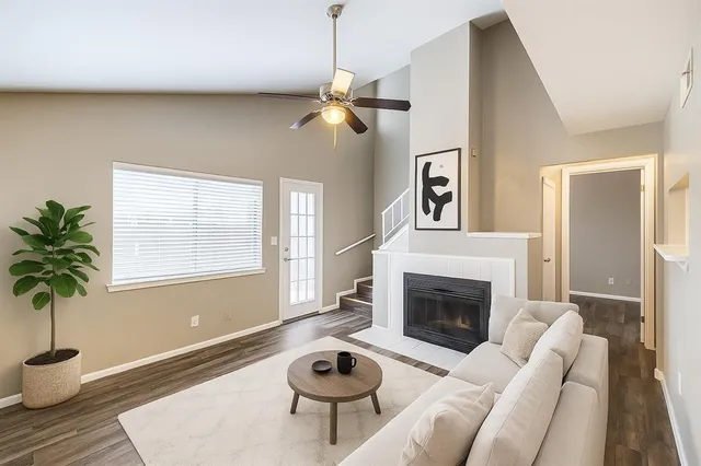 a living room with furniture and a fireplace